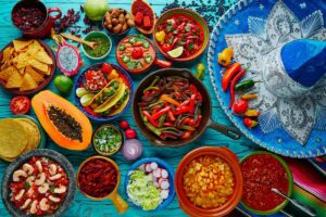 Mexican food on a table with sombrero