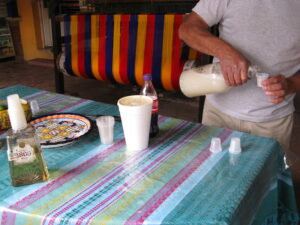 Mexico Drinks: Man serving Pulque